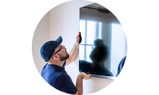 CS-Installation-Man placing a TV on a wall