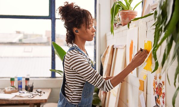Woman with Pixel buds painting