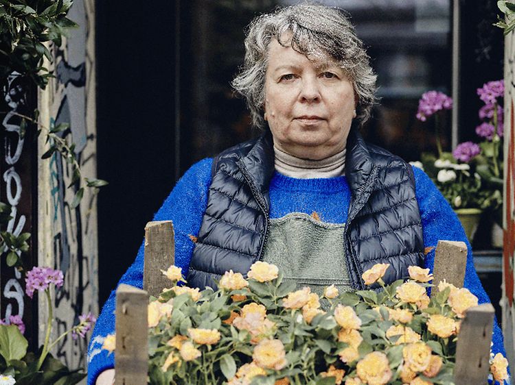 Female florist holding a box of flowers
