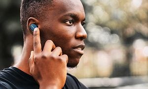 Man adjusting true wireless in-ears