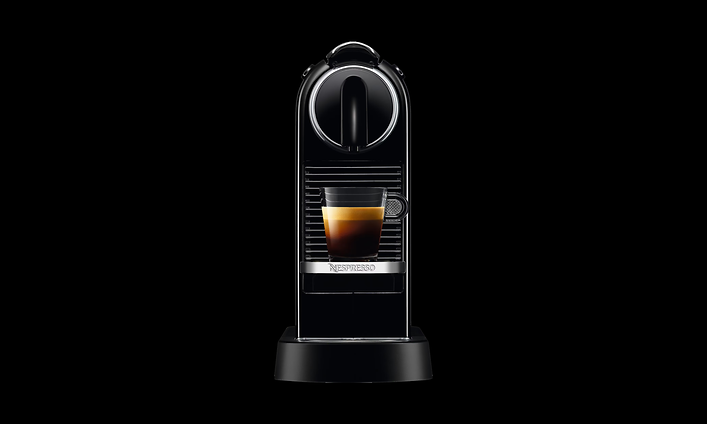 Nespresso Original kaffemaskin på en svart bakgrund