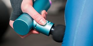 SDA - Massage - Picture of a woman using a massage gun on her calf