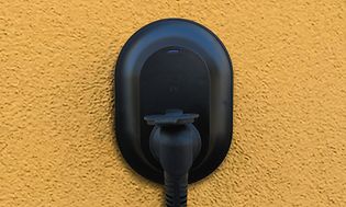 MDA - Cars and motor bikes - Charger box on a yellow wall