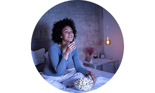 CS -Configuration-Woman eating popcorn in bed