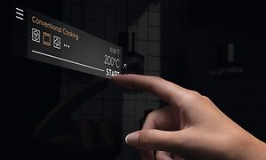 Finger selecting on Electrolux oven with EXCite+ Touch Display