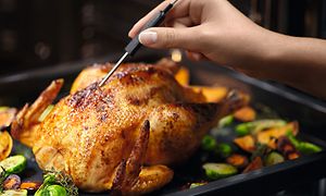 Chicken straight from the Electrolux oven being measured with Food Sensor thermometer