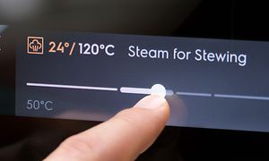 Electrolux oven with Steamify function and a finger pressing on the screen