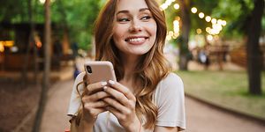 Woman smiling with phone