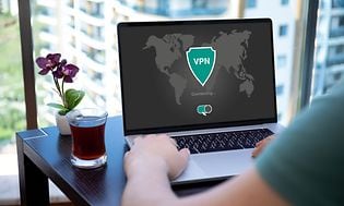 Computing - VPN - Laptop on a table with a VPN screen