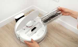 Cleaning the robot vacuum cleaner - removing the dust container