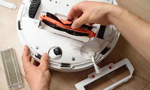 Robot vacuum cleaner maintenance - cleaning the brush