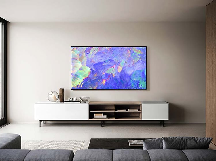 Samsung Chrystal UHD CU8575 TV on a living room wall