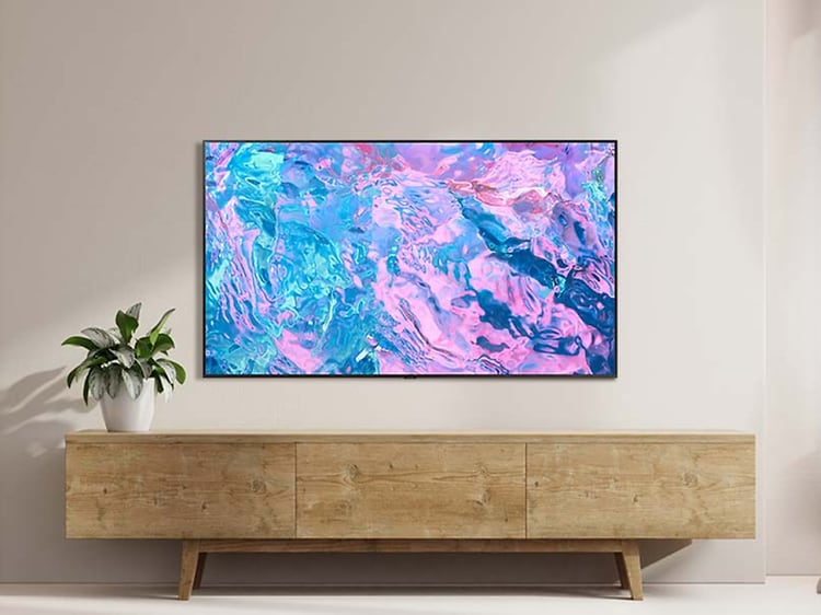 Samsung Chrystal UHD CU7175 TV on a living room wall