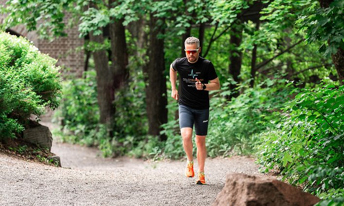 man running training smartwatch sunglasses