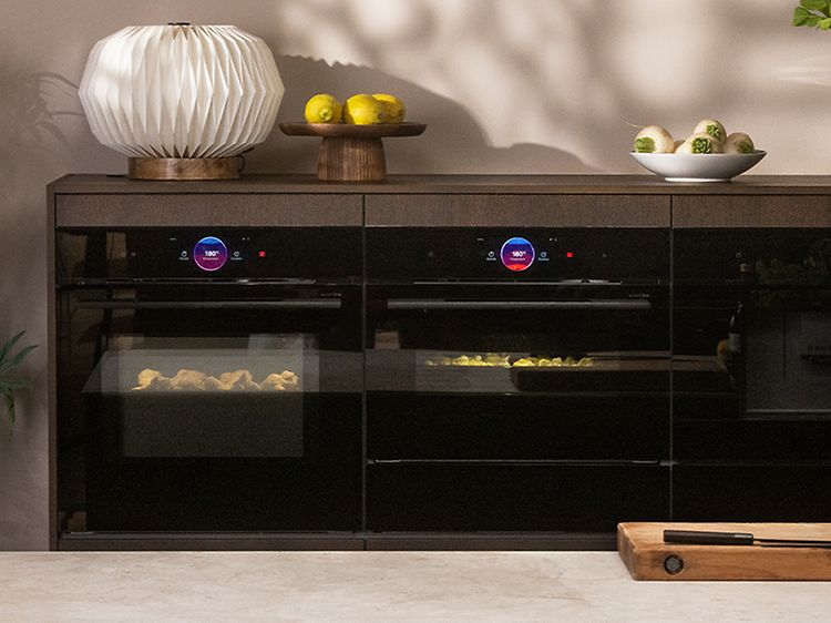 Bosch accent-line Carbon Black ovens built into the kitchen around details