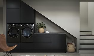 EPOQ Laundry Main Page. Black washing machine and laundry