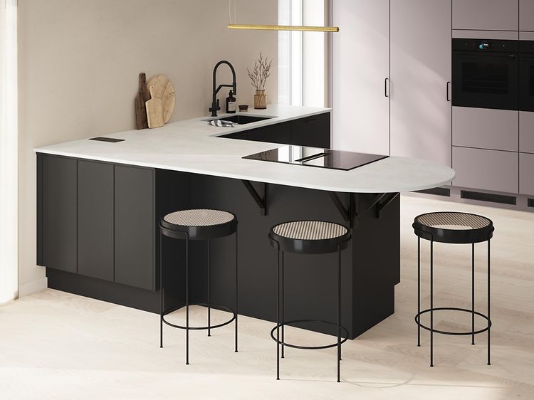 Black and grey Epoq kitchen and three chairs