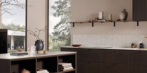 Dark oak kitchen with a white worktop