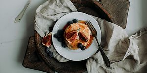 Pancake Day 2024 - Stack of pancakes with syrup, figs, and blueberries