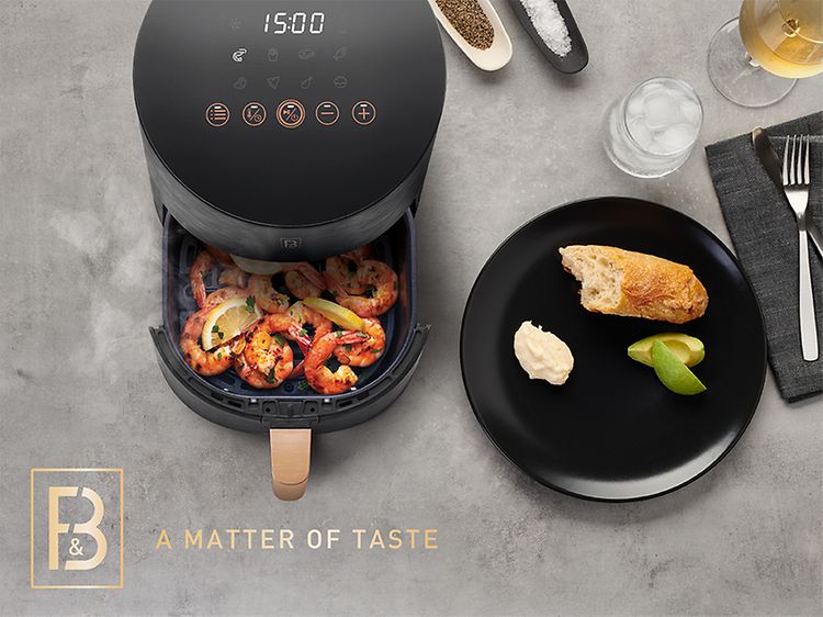 Airfryer med räkor och texten "a matter of taste"