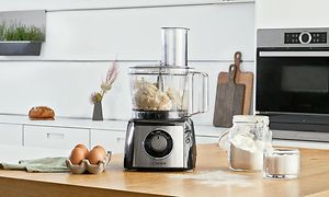 Bosch MultiTalent3 food processor MCM3PM386 on kitchen worktop next to eggs and flour