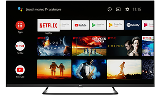 En svart smart-TV på stativ med olika streamingtjänster på skärmen.