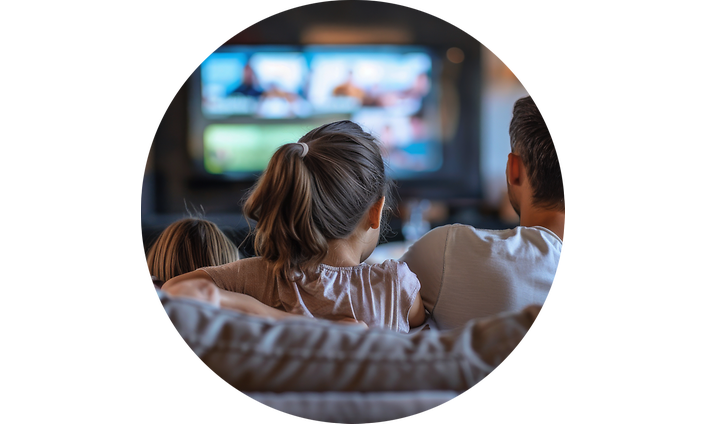 Mother, father and daughter watching TV